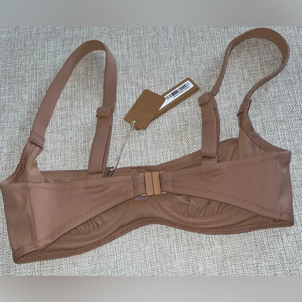 *7.  Skims Sculpting Ruched Swim Top